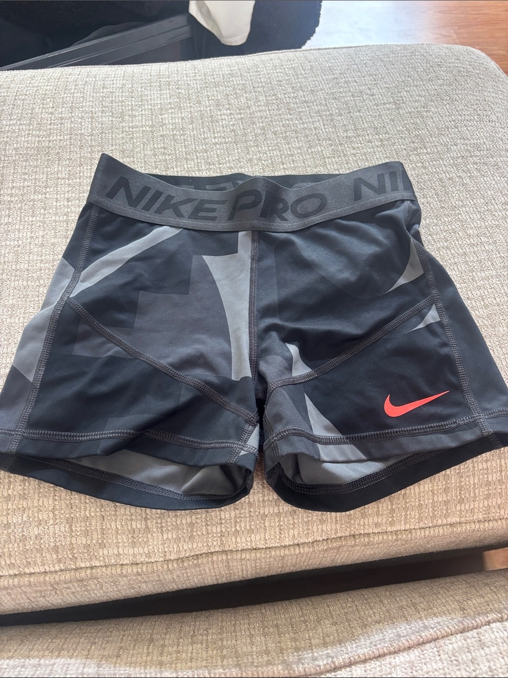 Nike Pro Women’s Black & Gray Athletic Shorts with Red Swoosh